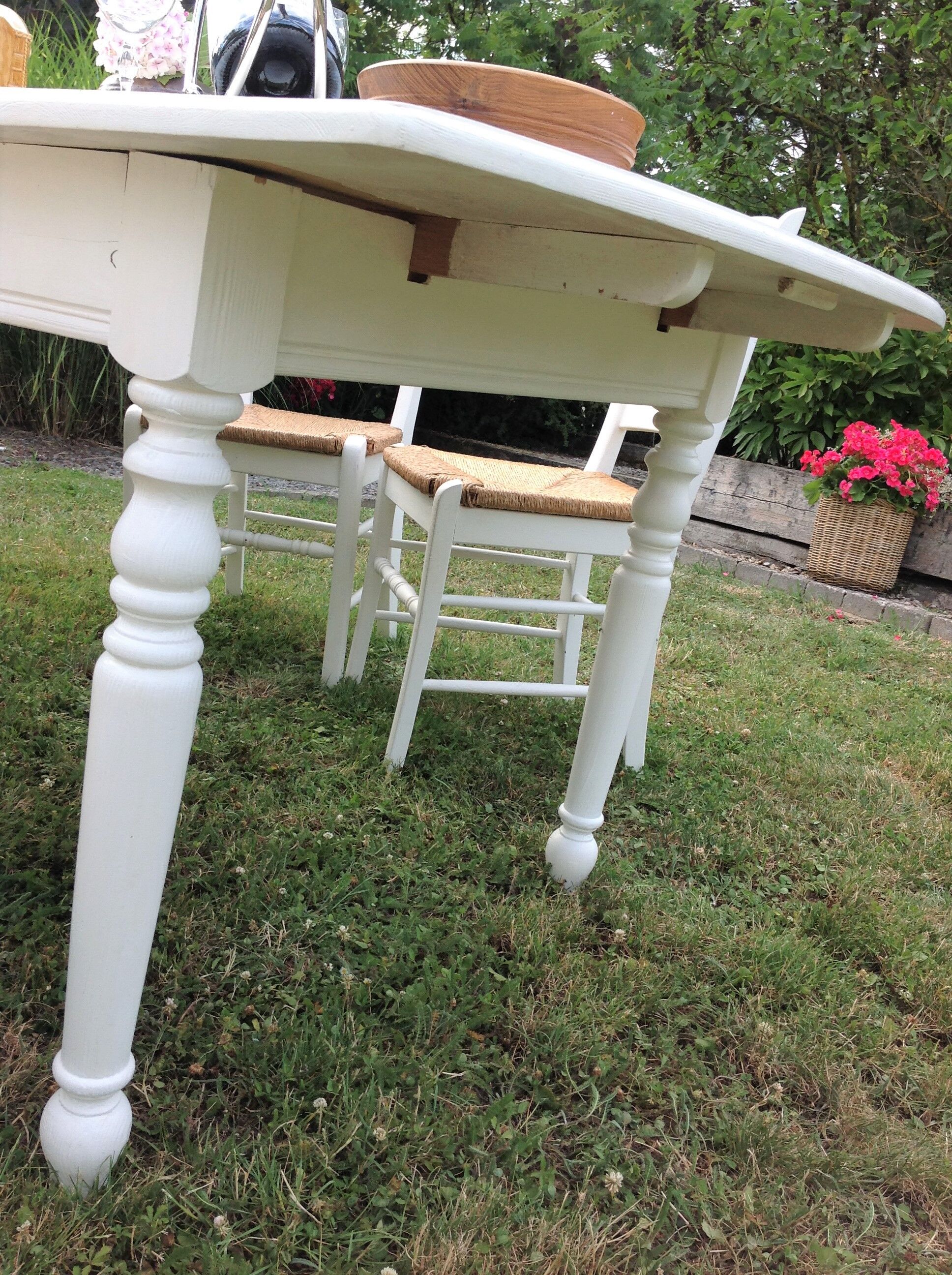 White farmhouse table set and four chairs