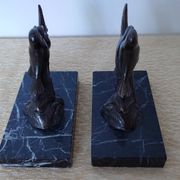 Pair of Art Deco bookends signed Frécourt, patinated metal & black marble