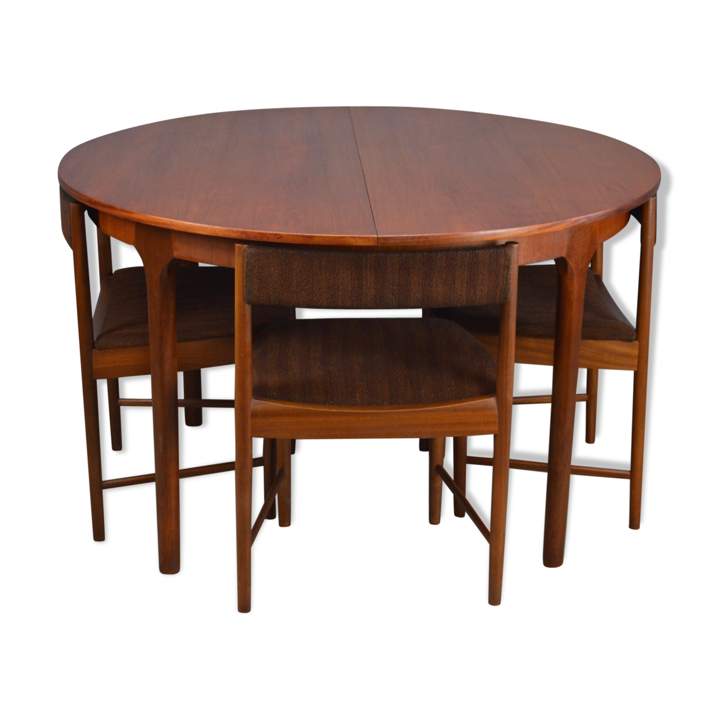 Round teak dinning table and chairs by Mctintosh