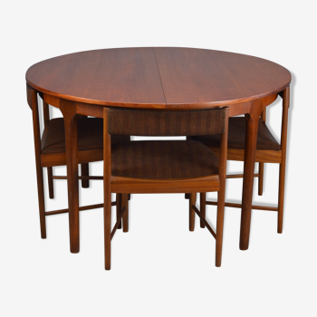 Round teak dinning table and chairs by Mctintosh