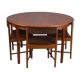 Table rondes et chaises en teck par Mcintosh