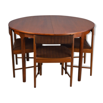Round teak dinning table and chairs by Mctintosh