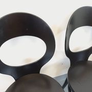 Set of 4 vintage Mouette chairs by Baumann in black wood from the 1960s.