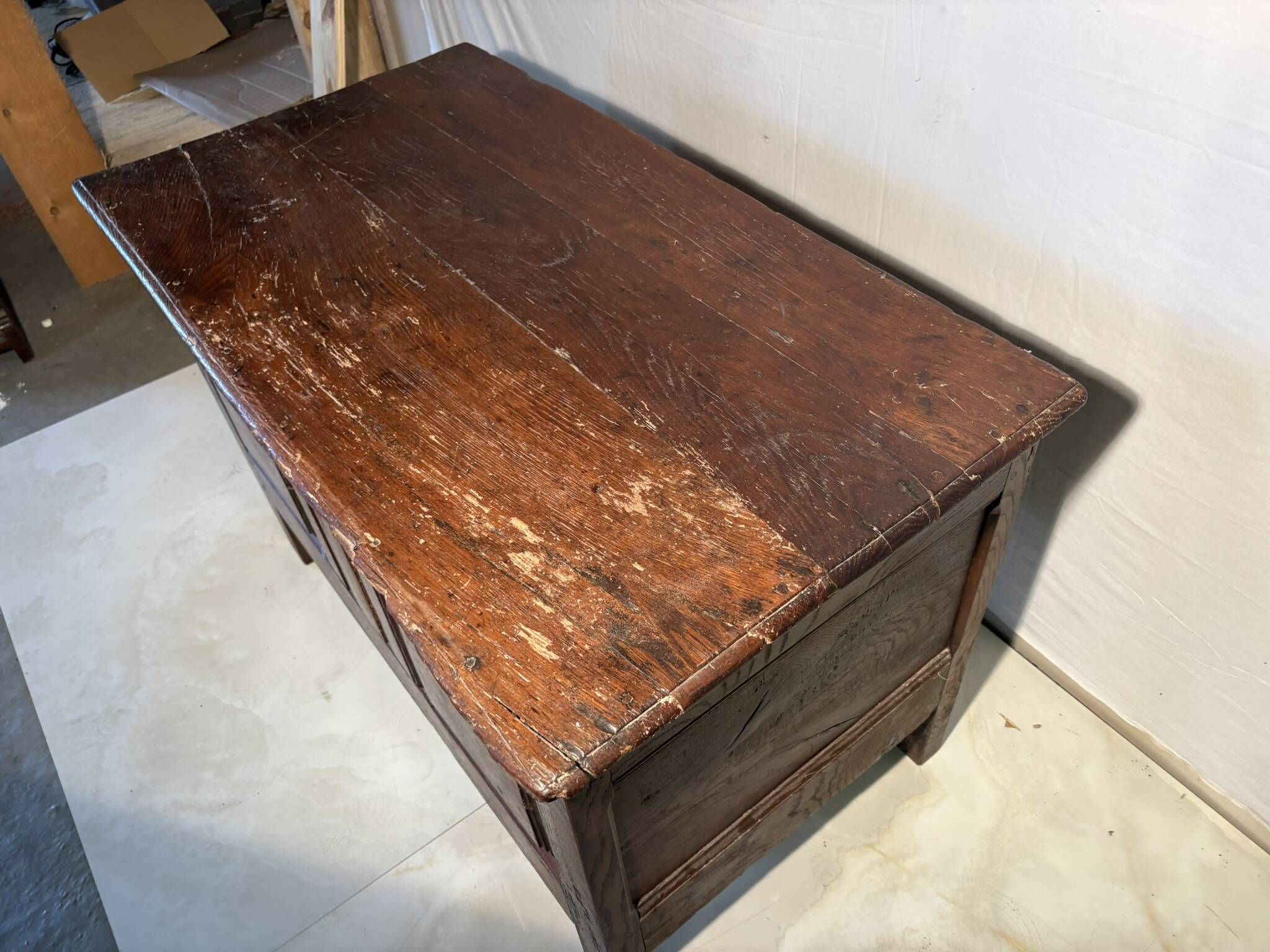 Rustic antique oak chest, original fittings and moulded panels.