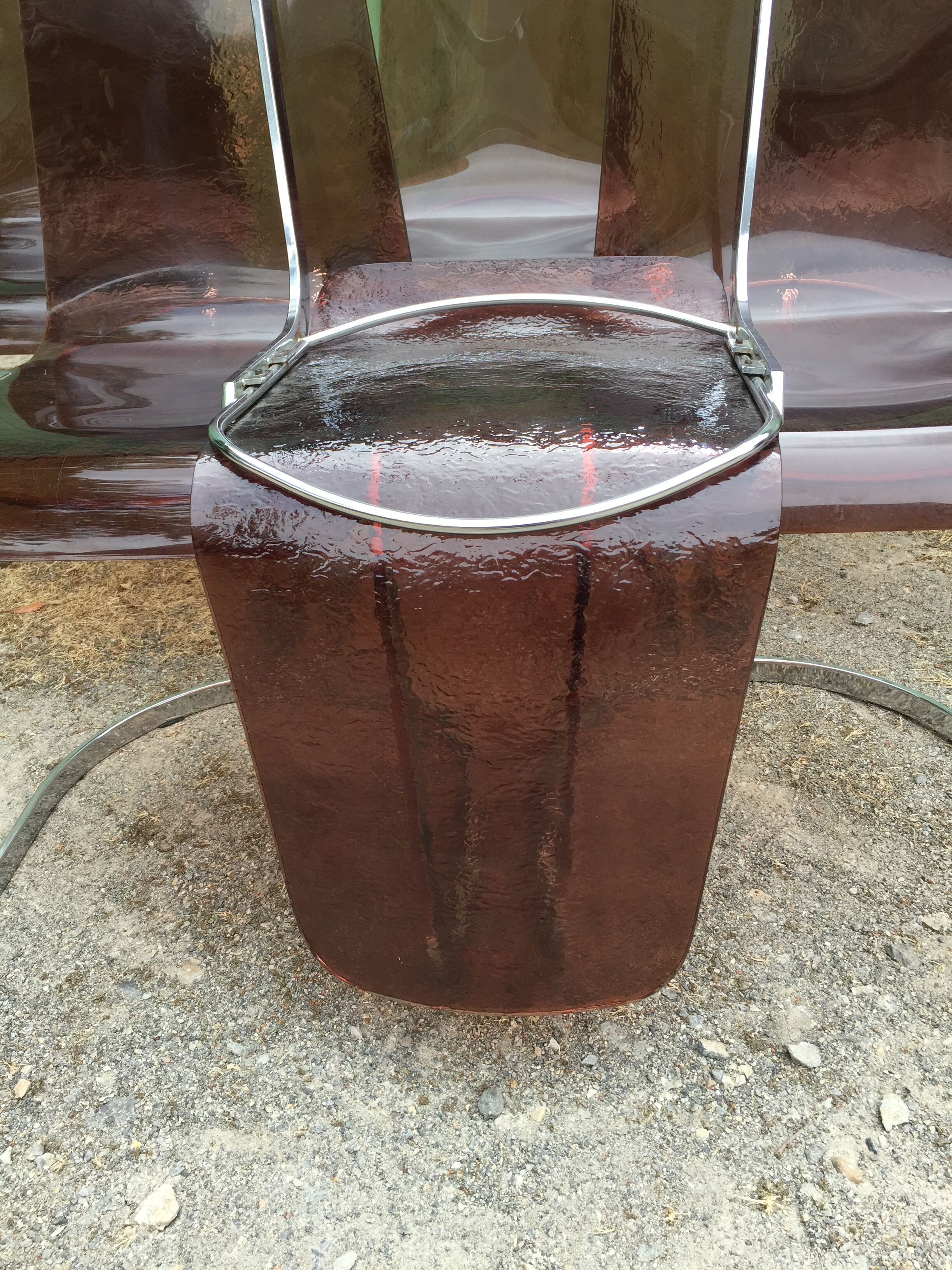 Chairs in plexiglas with chrome metal base