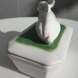 Pot terrine rabbit of Bavent in white earthenware on square of greenery