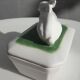Pot terrine rabbit of Bavent in white earthenware on square of greenery