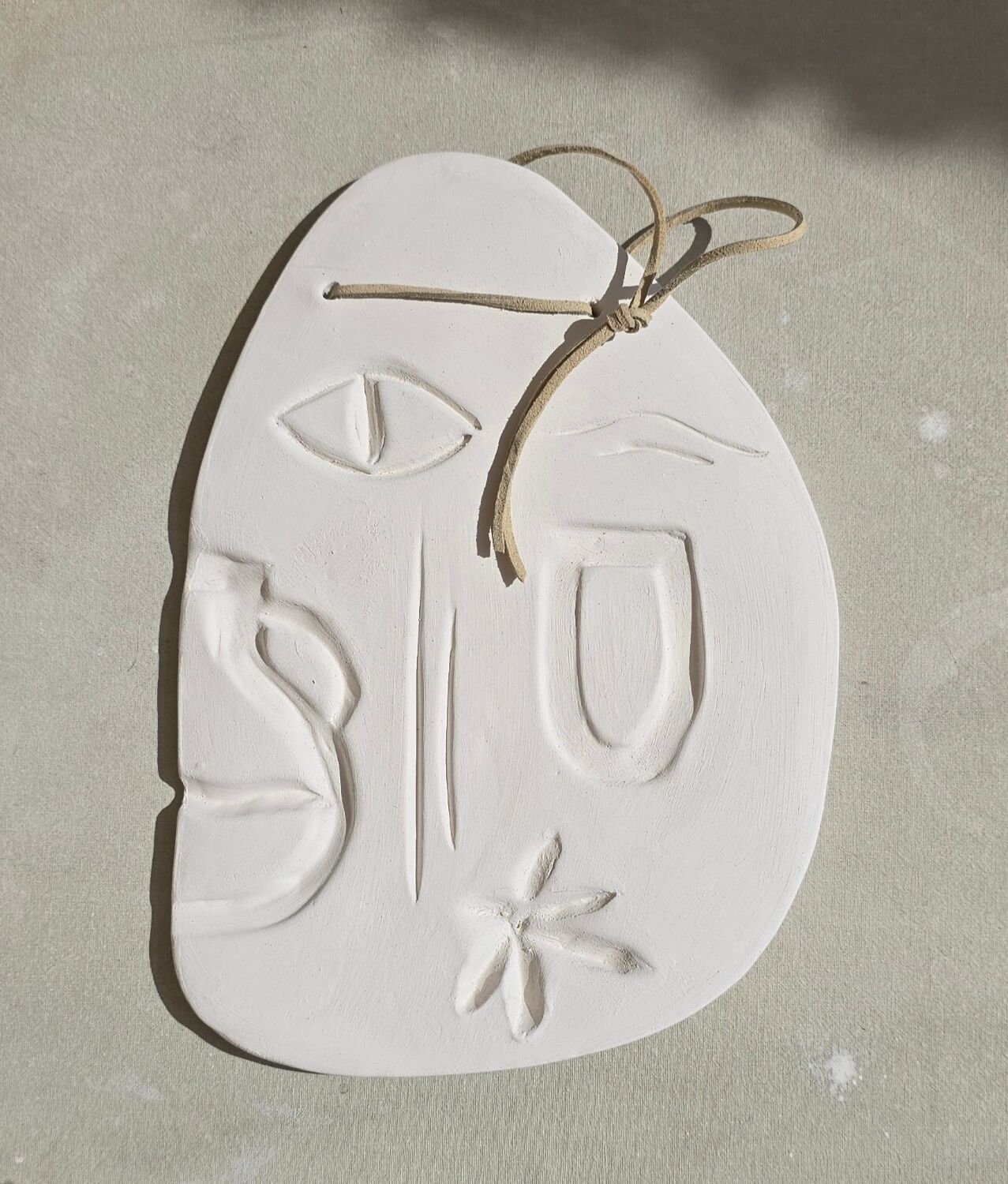Mediterranean sculpted plaque