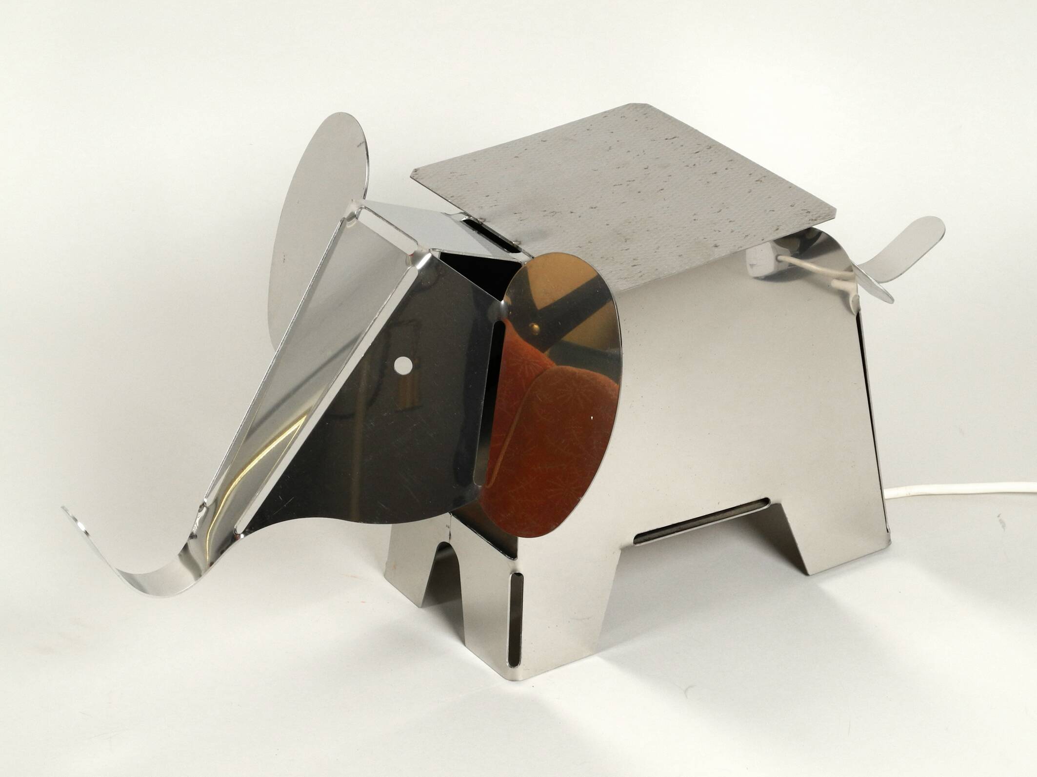 80s heavy metal chrome elephant floor lamp as side table Postmodern design