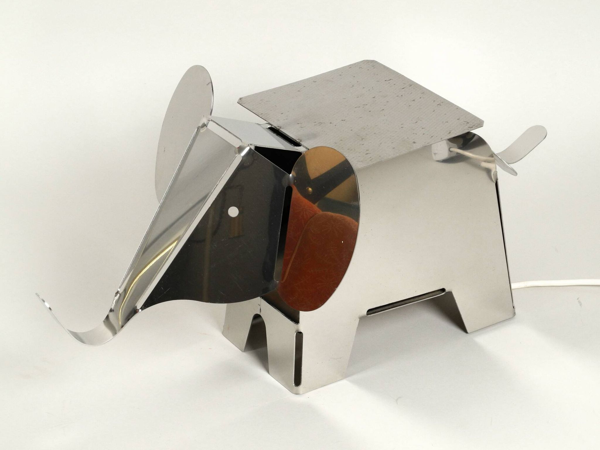 80s heavy metal chrome elephant floor lamp as side table Postmodern design