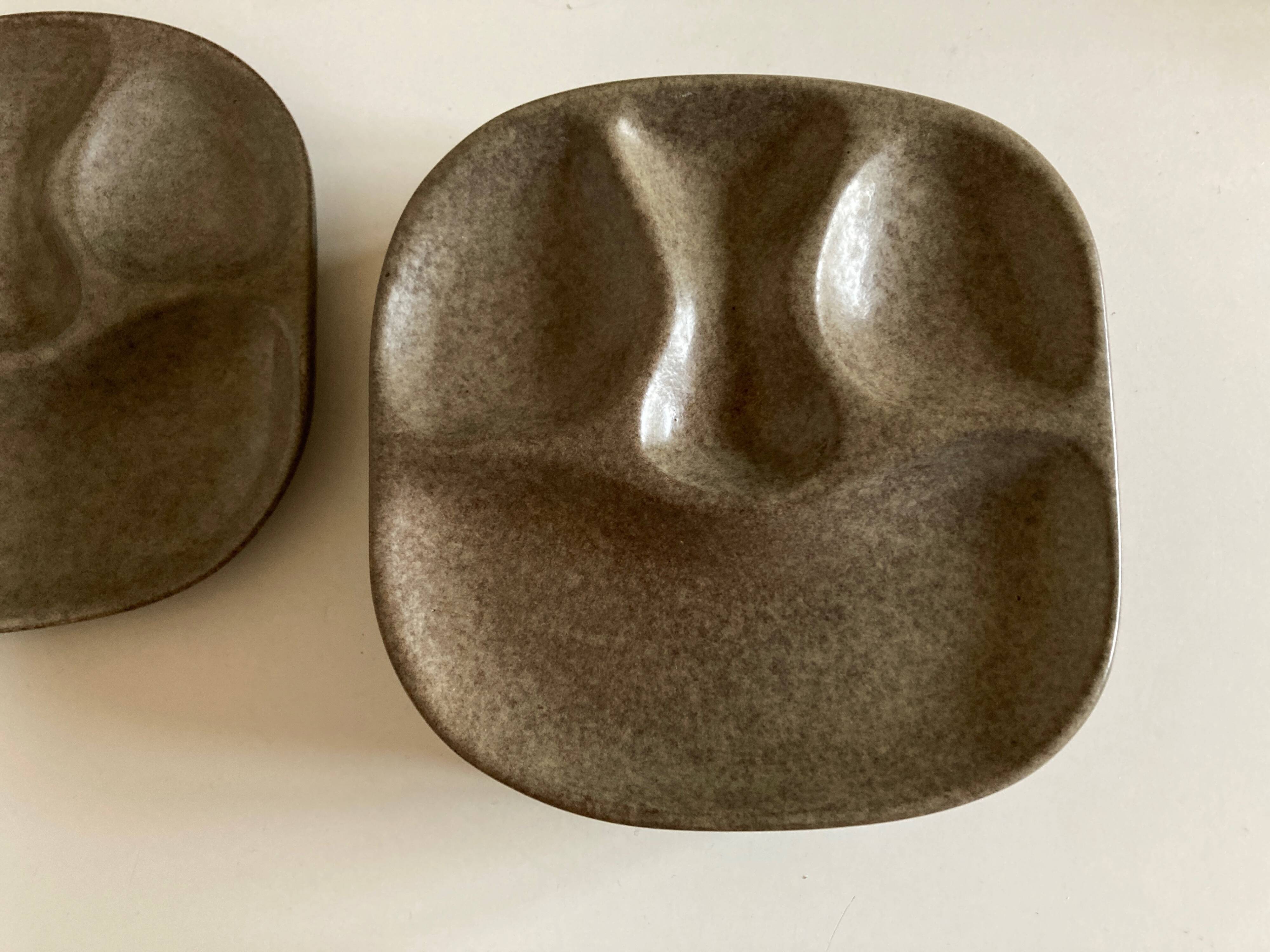 Set of 8 mid century modern stoneware potter's plates to identify