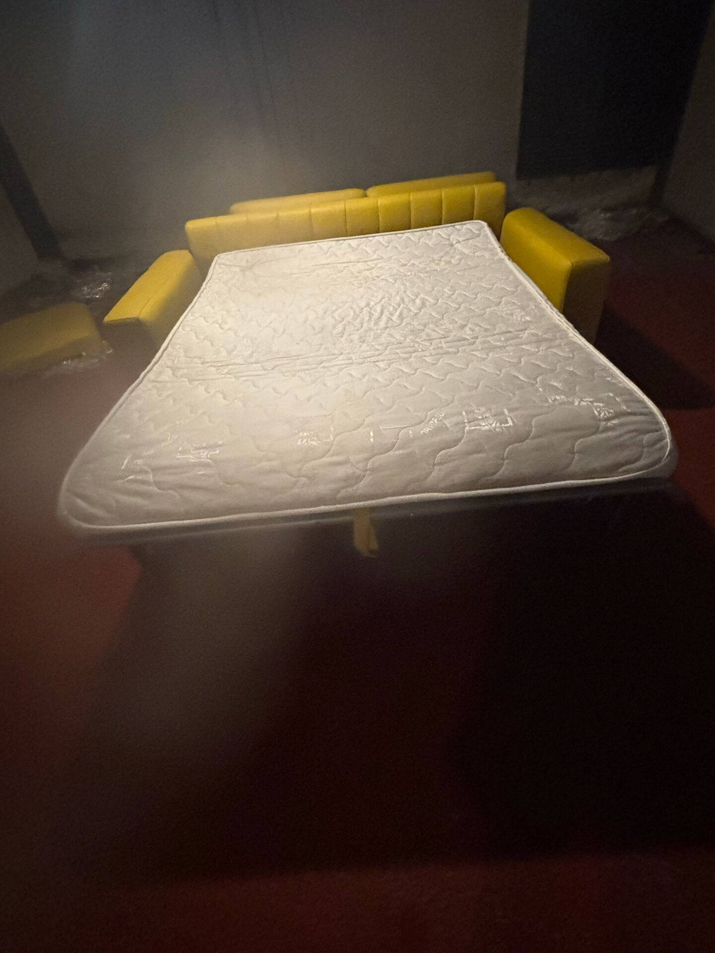 Yellow leather convertible sofa made in Italy.