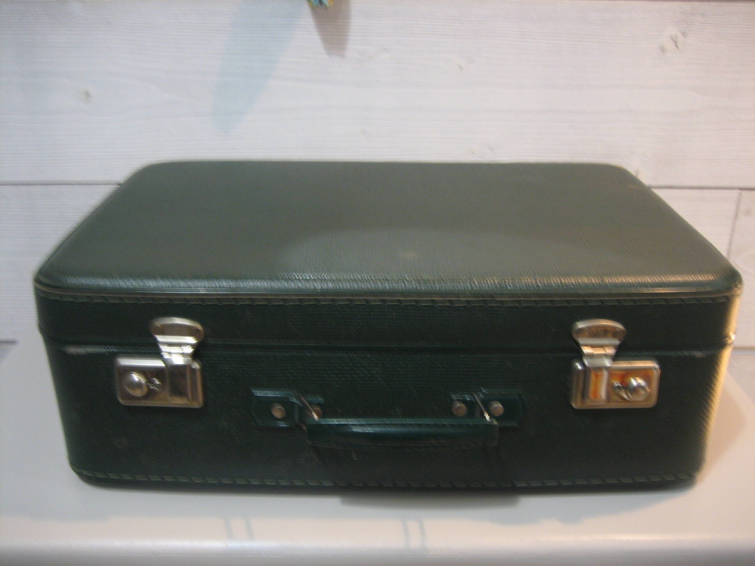 Dark green suitcase