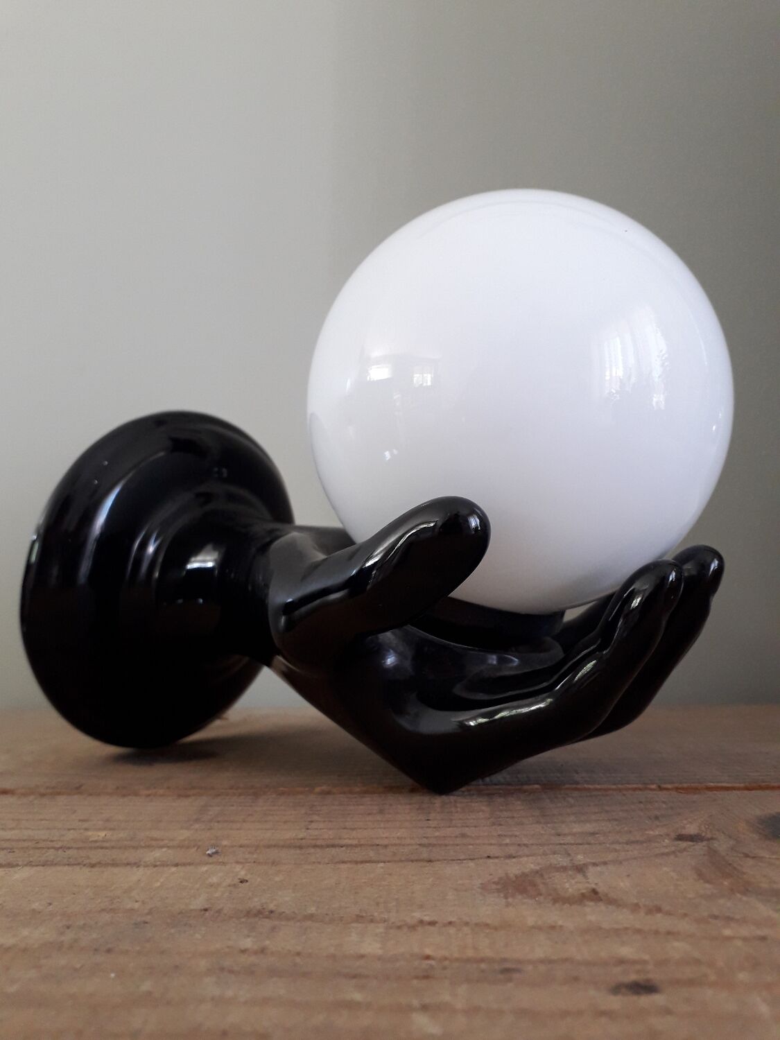 Hand and opaline globe wall light