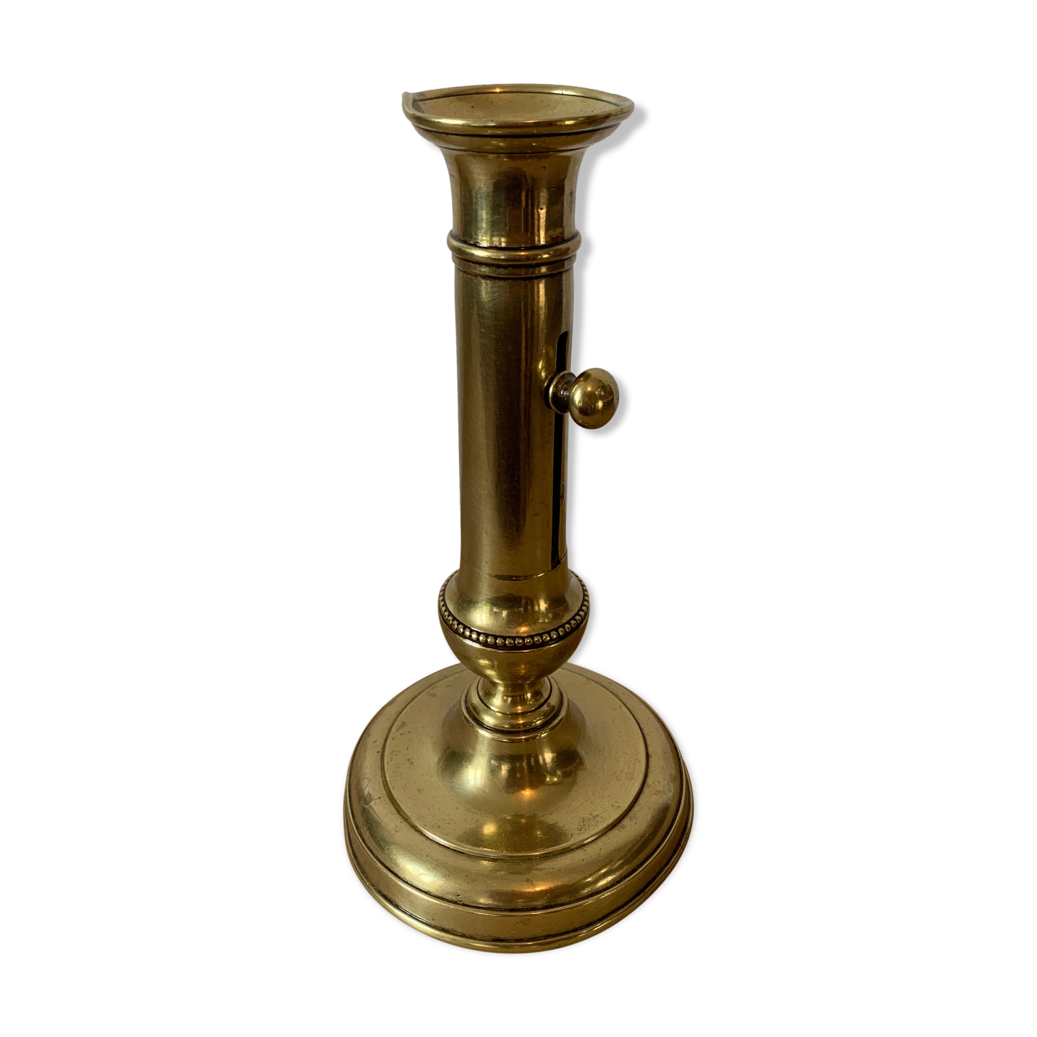 Brass pusher candle holder
