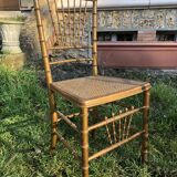 Pair of caned chairs in gilded wood