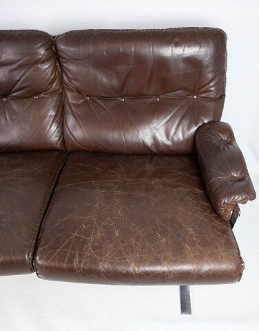 Three seater sofa upholstered with patinated brown leather by Arne Norell, 1970s