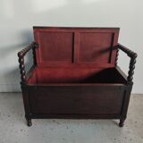 Natural wood chest forming a bench, ringed shoulders