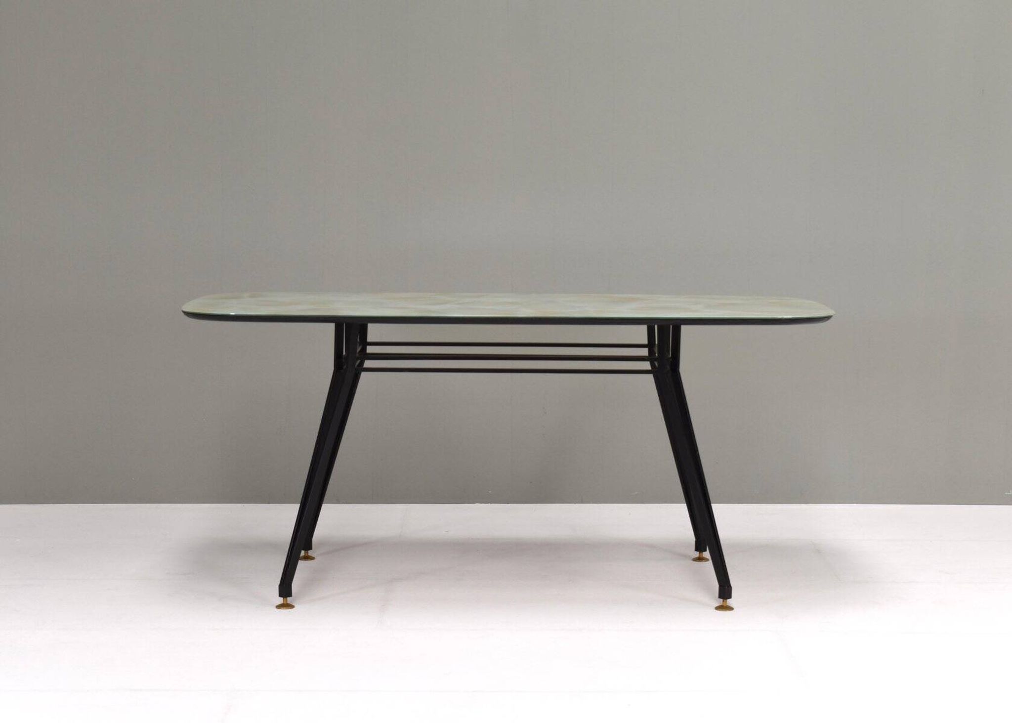 Italian dining table with metal base and glass top and brass, 1950s