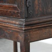 Unique antique English cabinet on stand made of oak from the 17th century