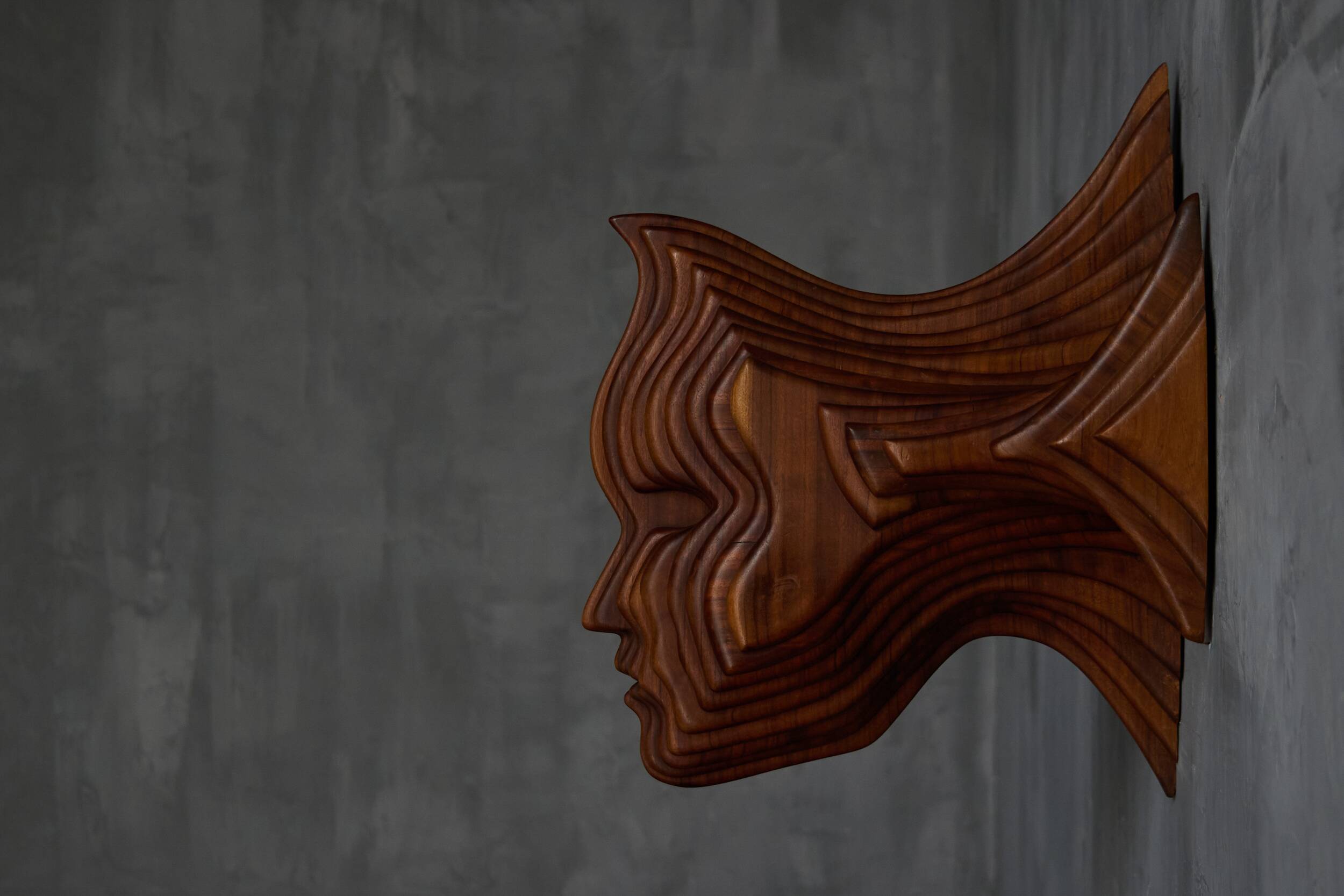 Sculptural carved wooden mask wall panel, France, 1970s
