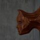 Sculptural carved wooden mask wall panel, France, 1970s