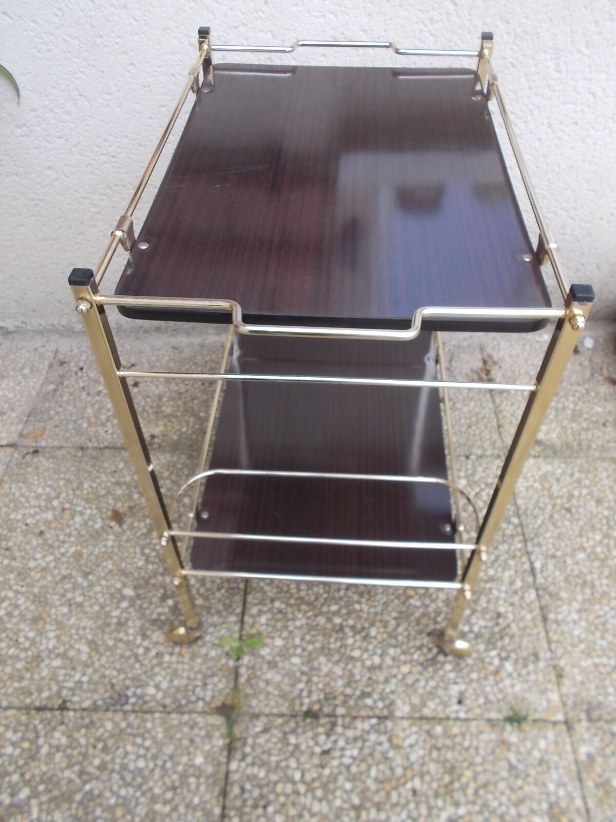 Rolling serving table in brass