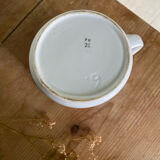 Old striped milk jug