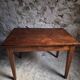 Old French table in cherry wood with bistro chair, circa 1900–1930.