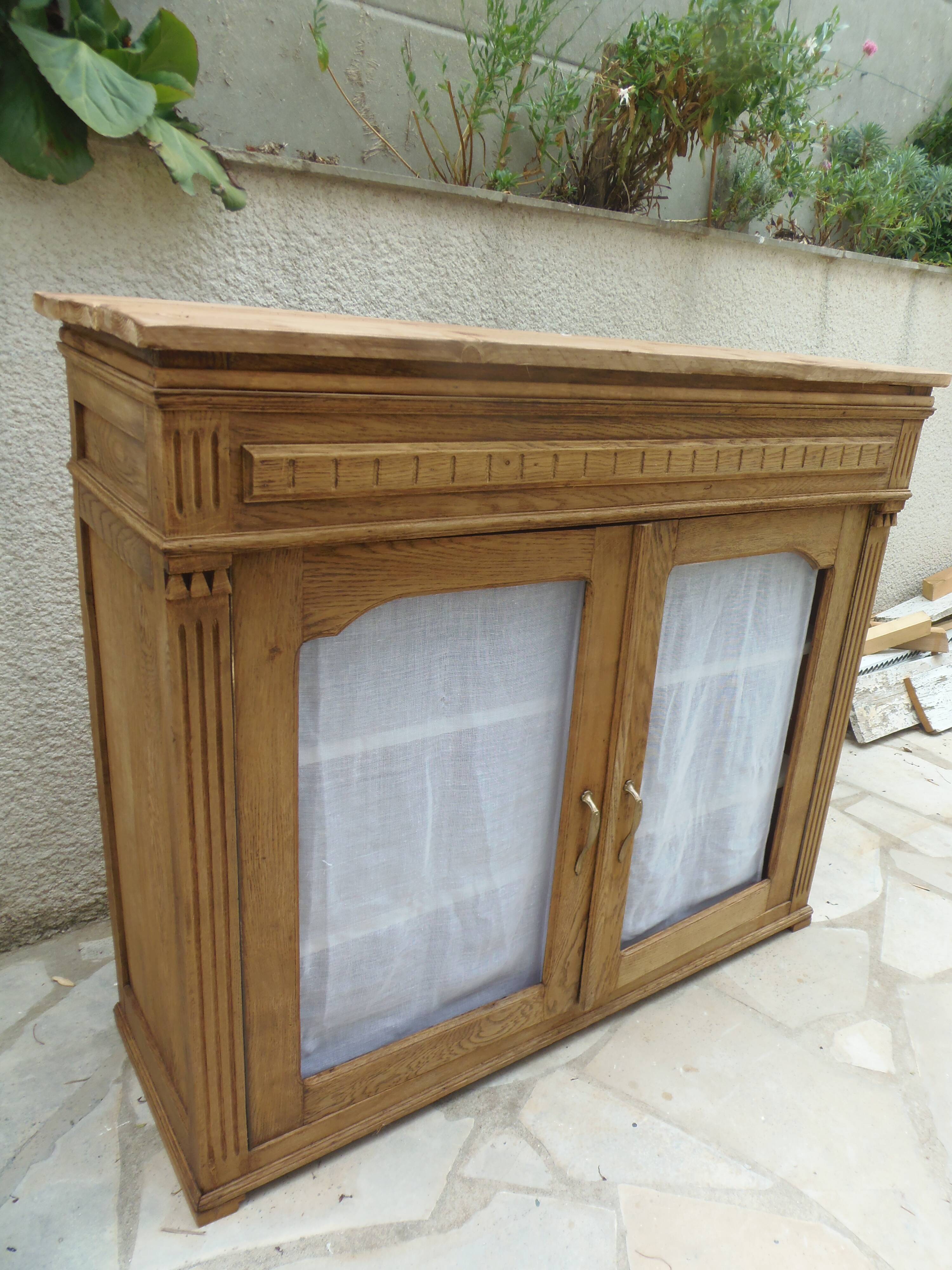 Antique wooden sideboard, fabric doors and pearl grey shelves.