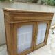 Antique wooden sideboard, fabric doors and pearl grey shelves.