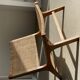 Reclining armchair in natural wood and woven rattan
