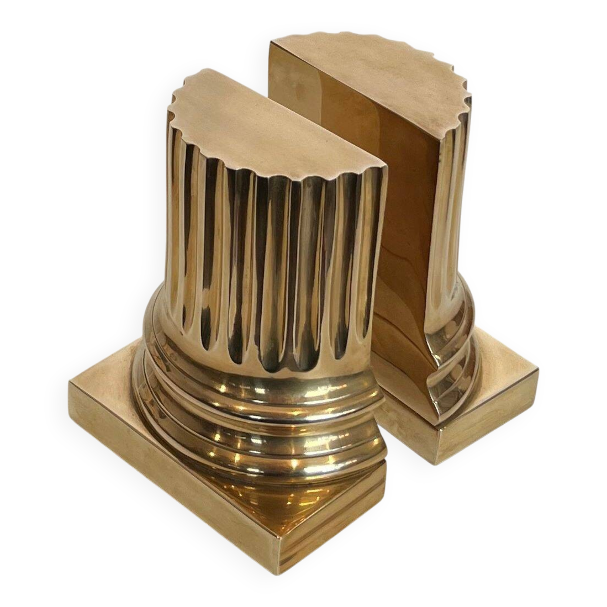A pair of brass bookends representing columns.