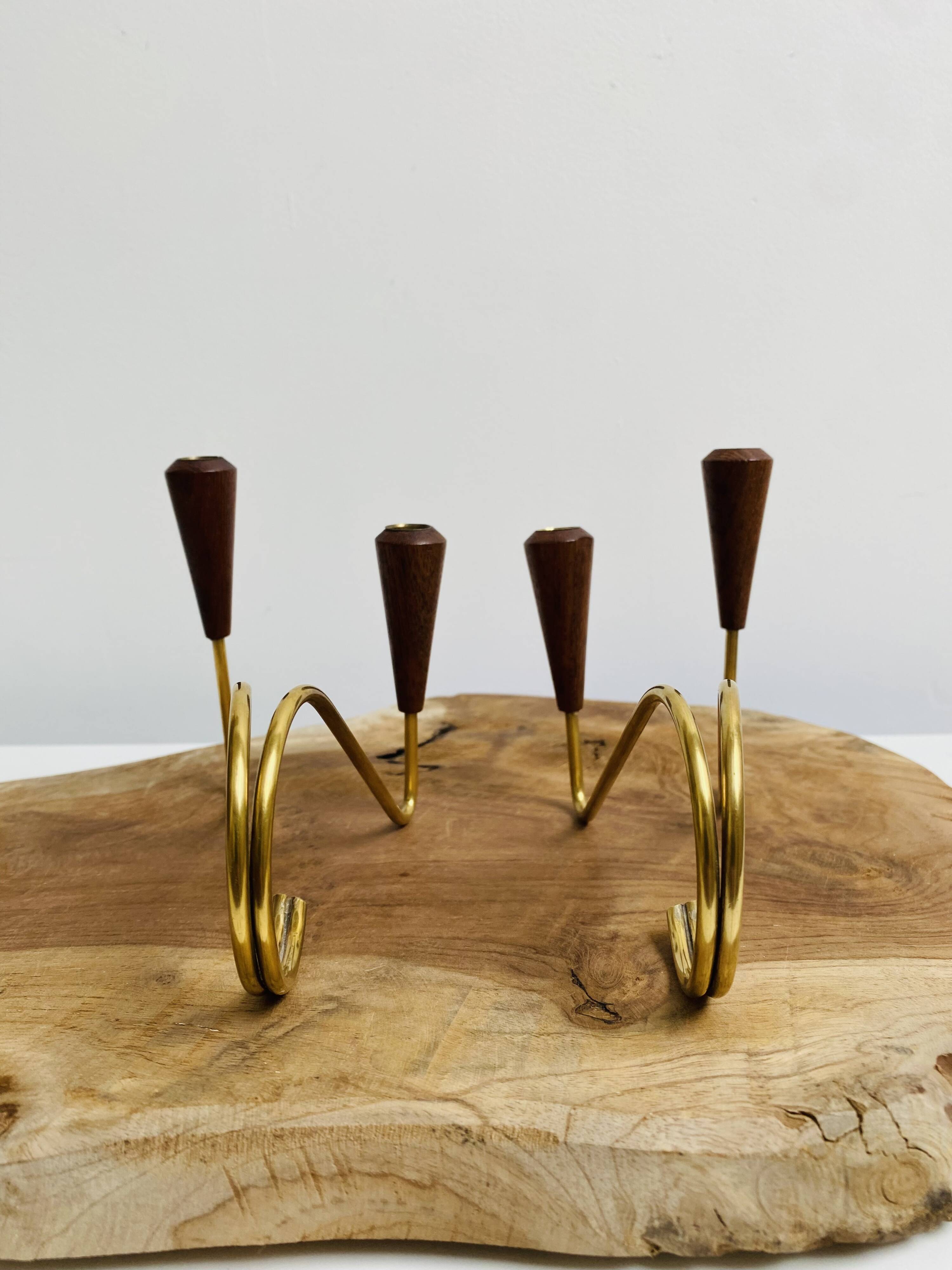 Pair of teak and brass candlesticks