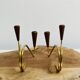 Pair of teak and brass candlesticks