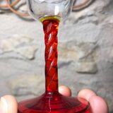 Antique and rare! Sold in a set of 12 colorful twisted stemmed glasses engraved with flowers and leaves