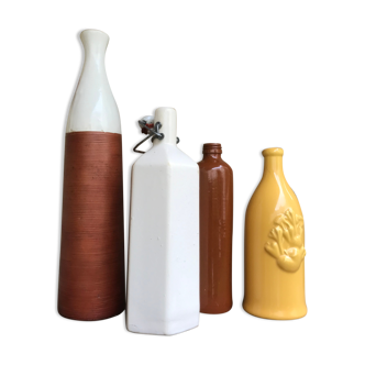Set of four glazed ceramic bottles