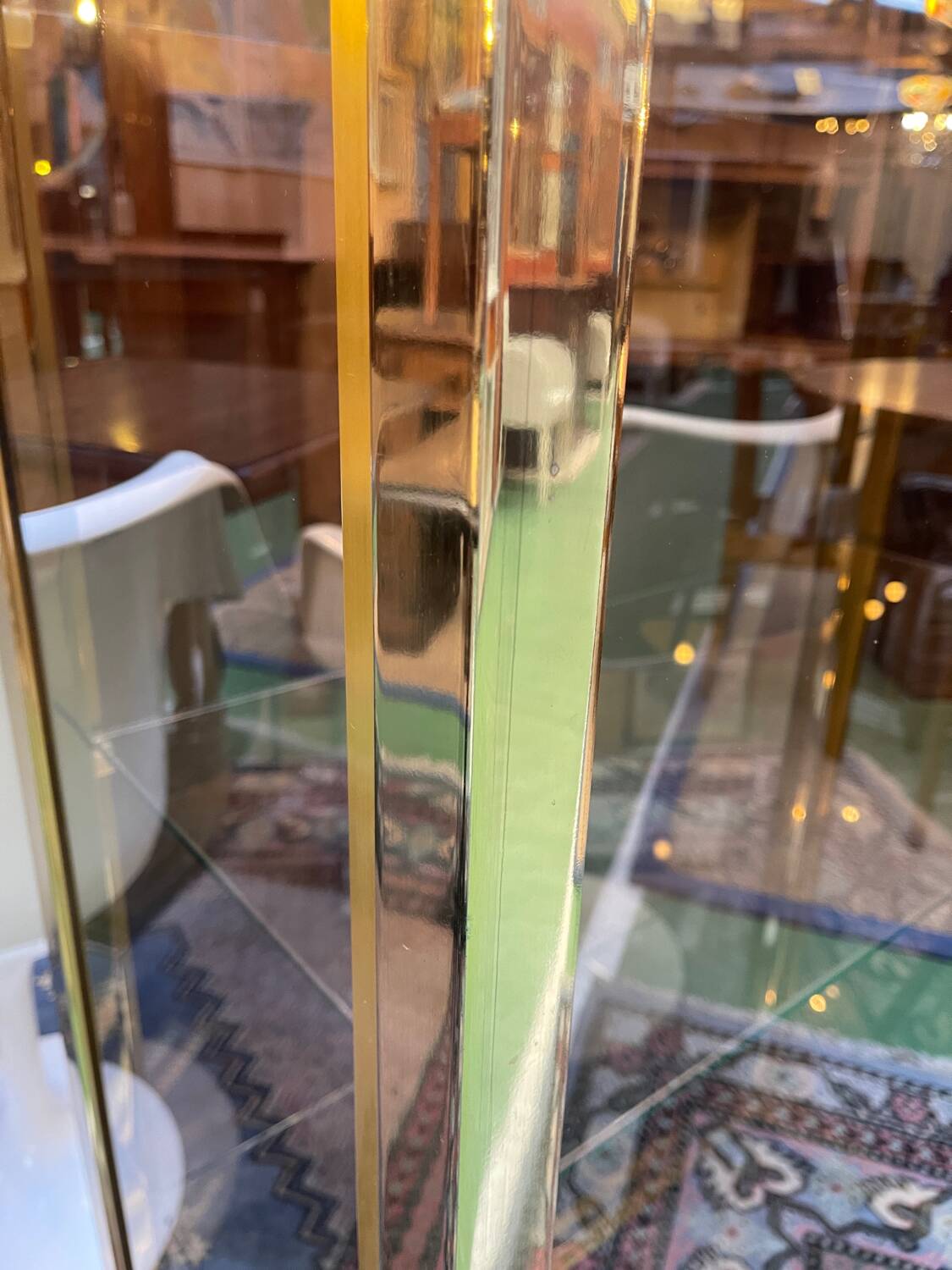 Exhibition showcase in gold-plated chrome and smoked glass - work from the 1980s.