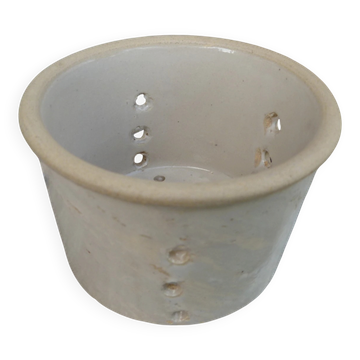 Beige stoneware cheese drainer