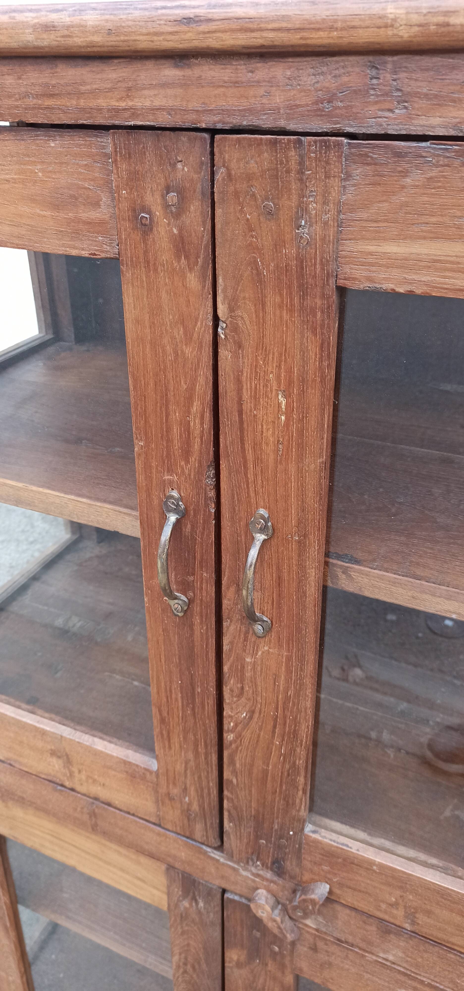 Old wooden display cabinet with three glazed sides