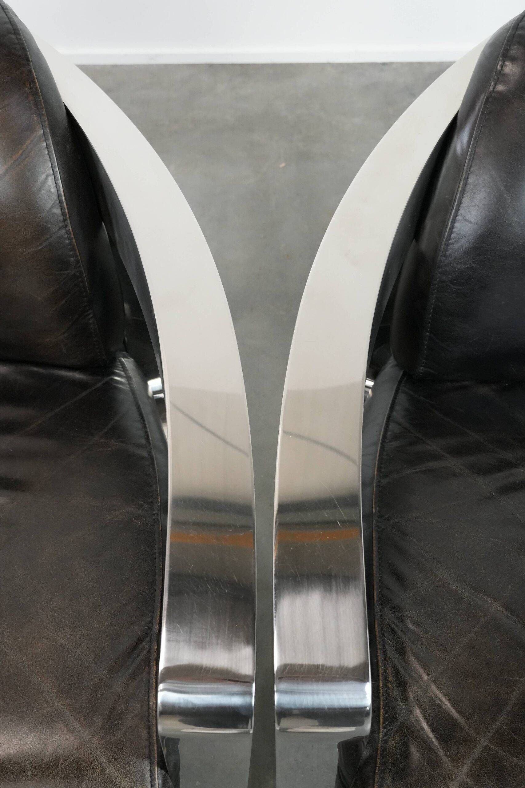 Set of two cowhide leather Aviator design armchairs with aluminium