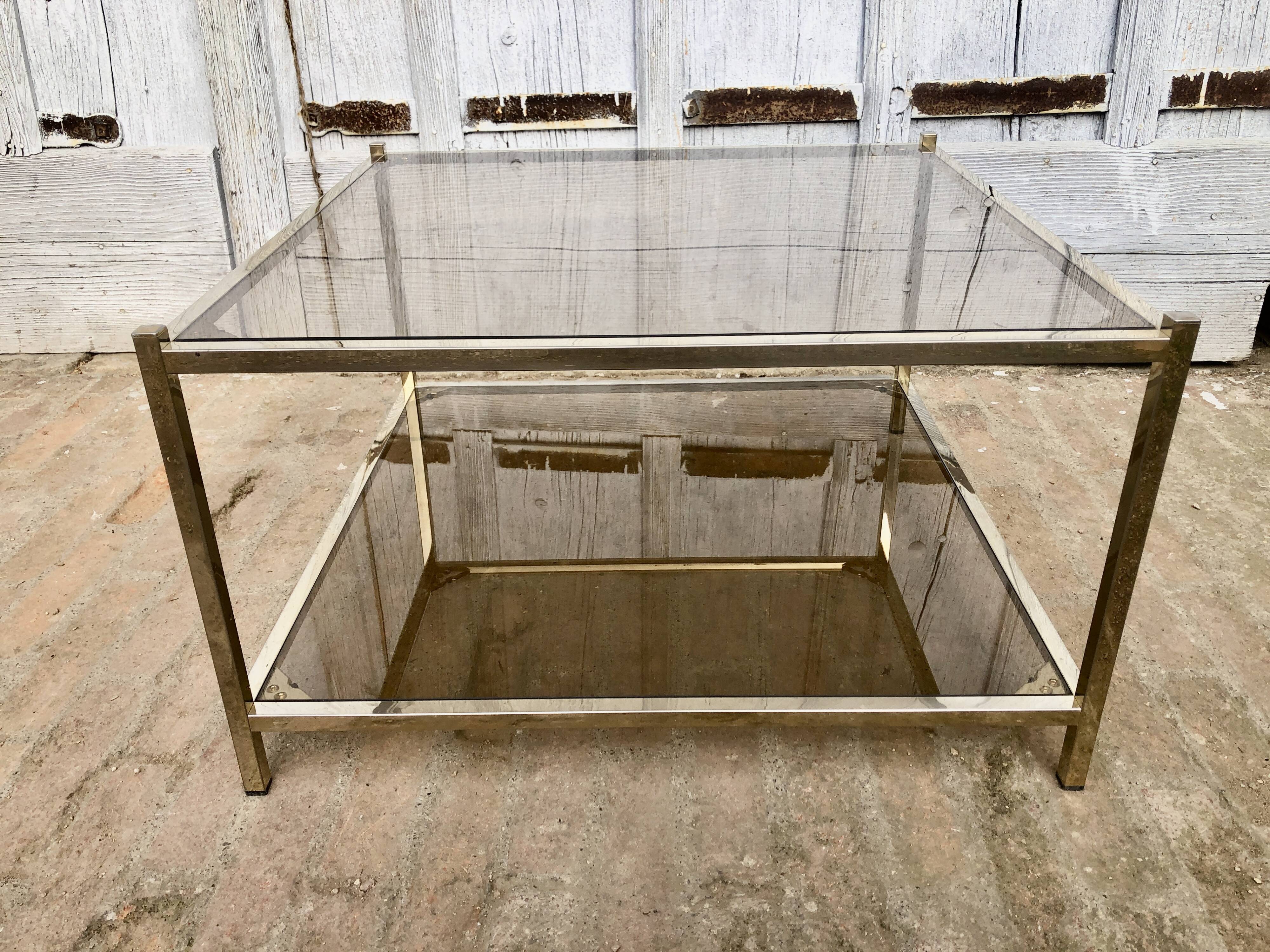 Square brass coffee table and smoked glasses