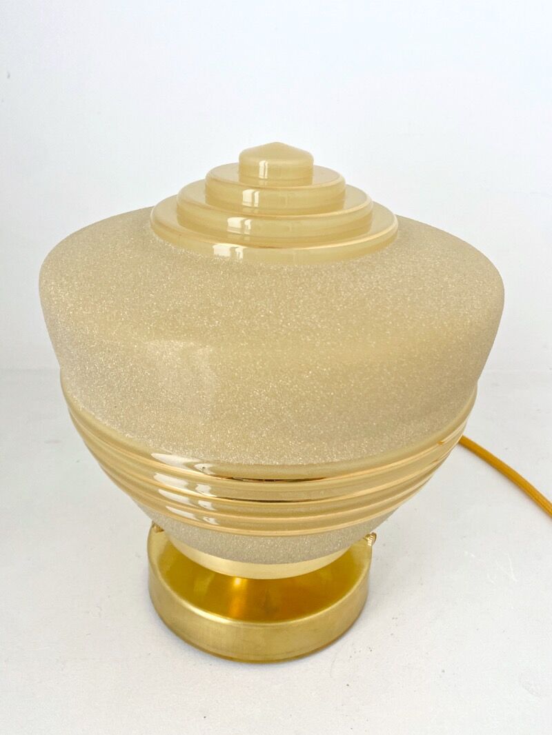 Old globe table lamp in beige and gold glass