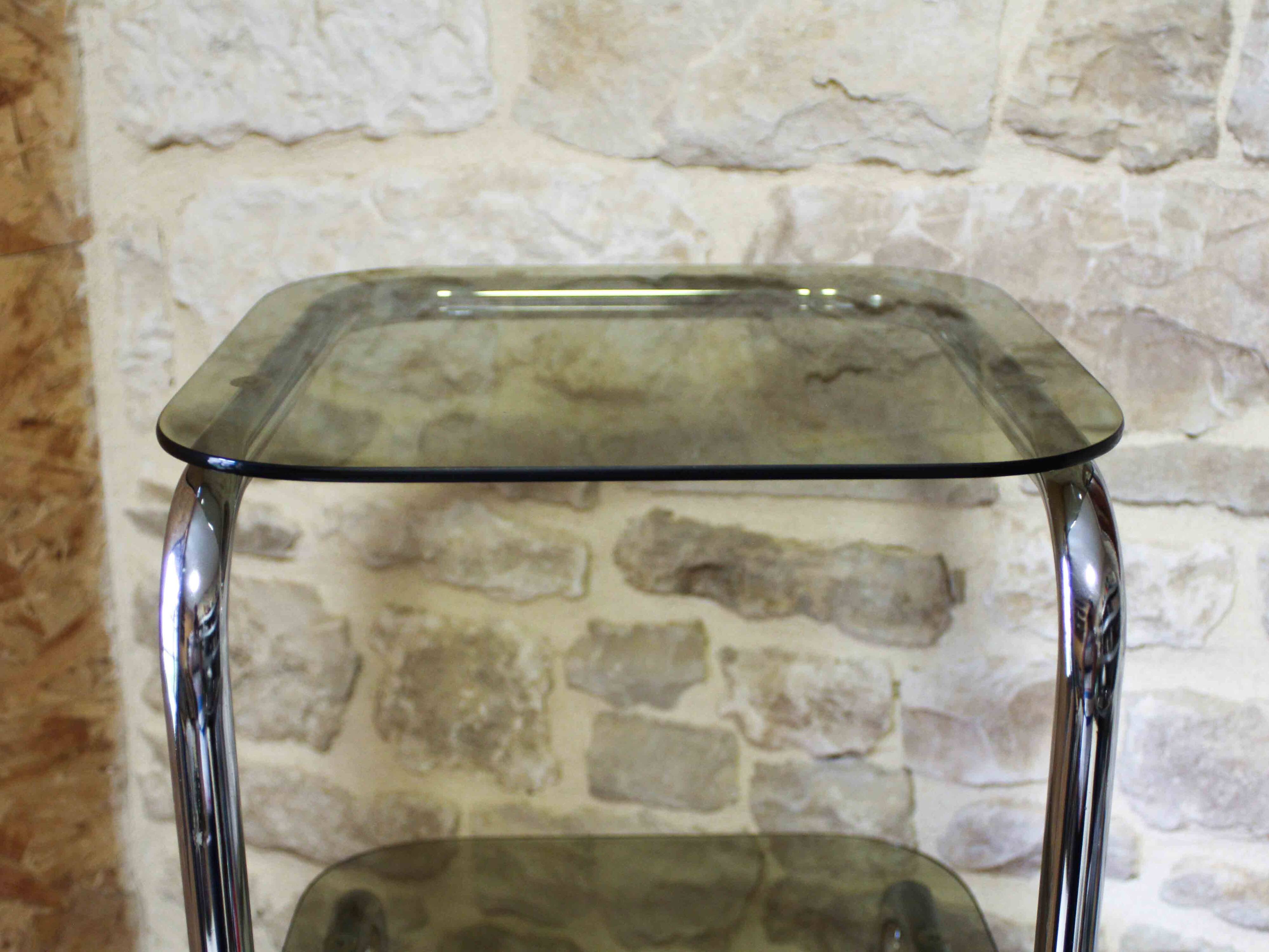 Chrome metal and smoked glass side table.
