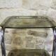 Chrome metal and smoked glass side table.