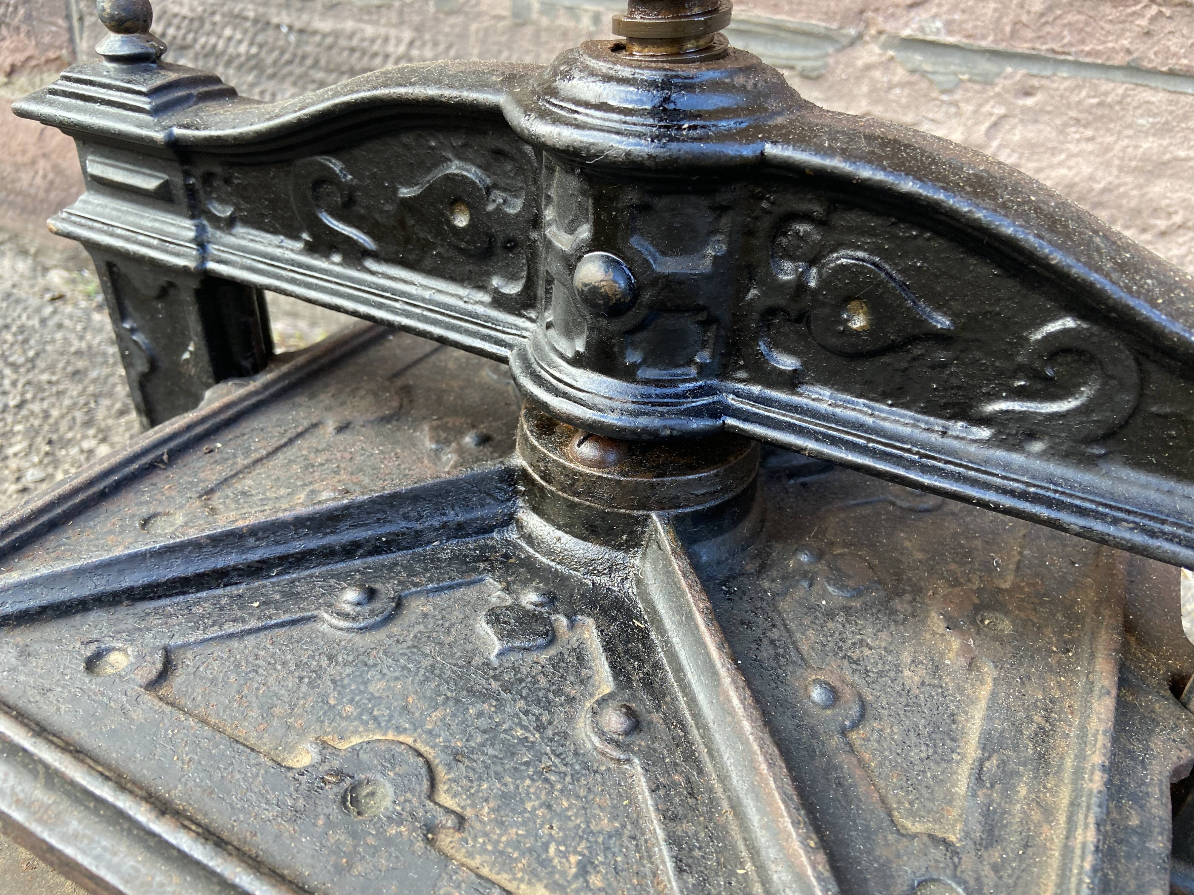 Old printing press in very old cast iron