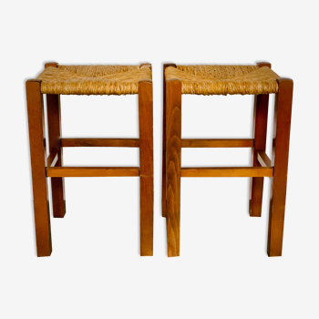 Two light wooden stools varnished and mulched seat
