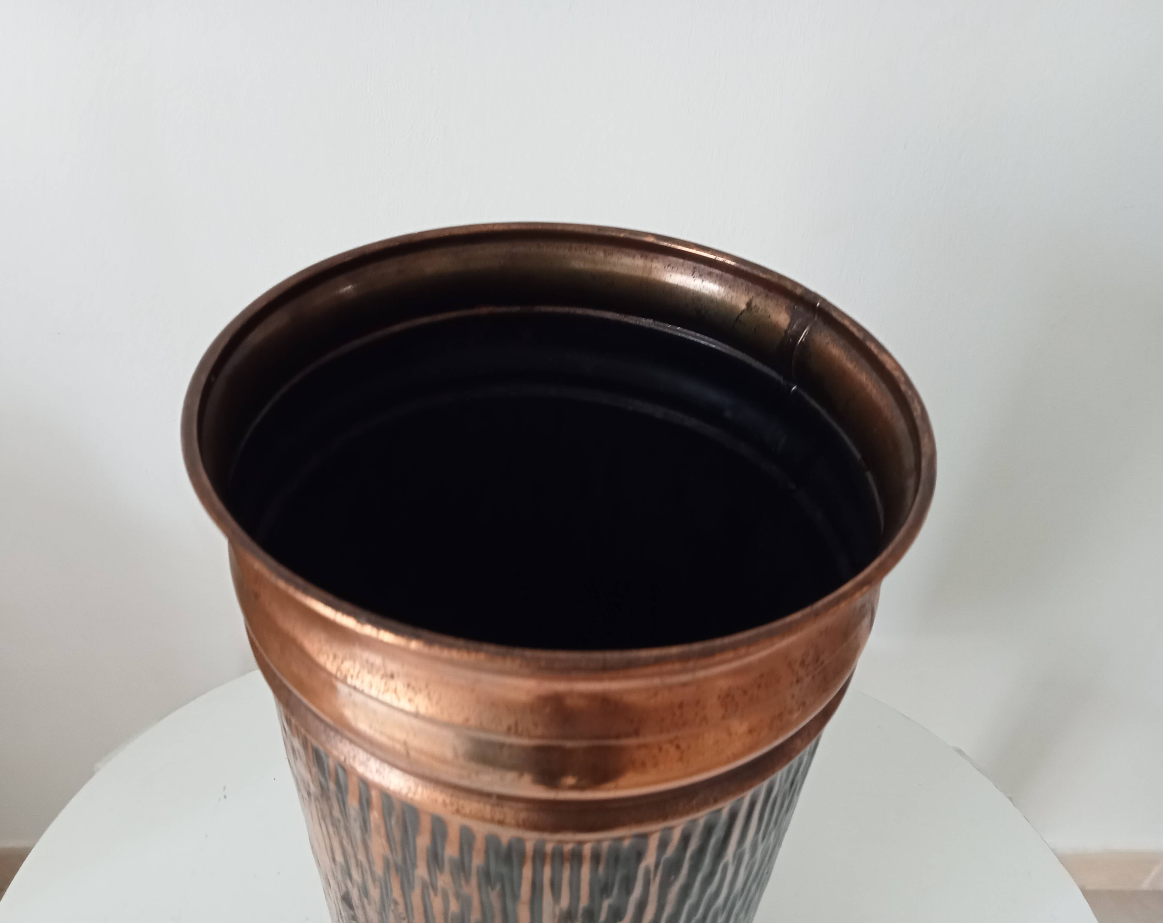 Vintage brutalist umbrella stand in hammered copper with a wood effect.