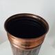 Vintage brutalist umbrella stand in hammered copper with a wood effect.