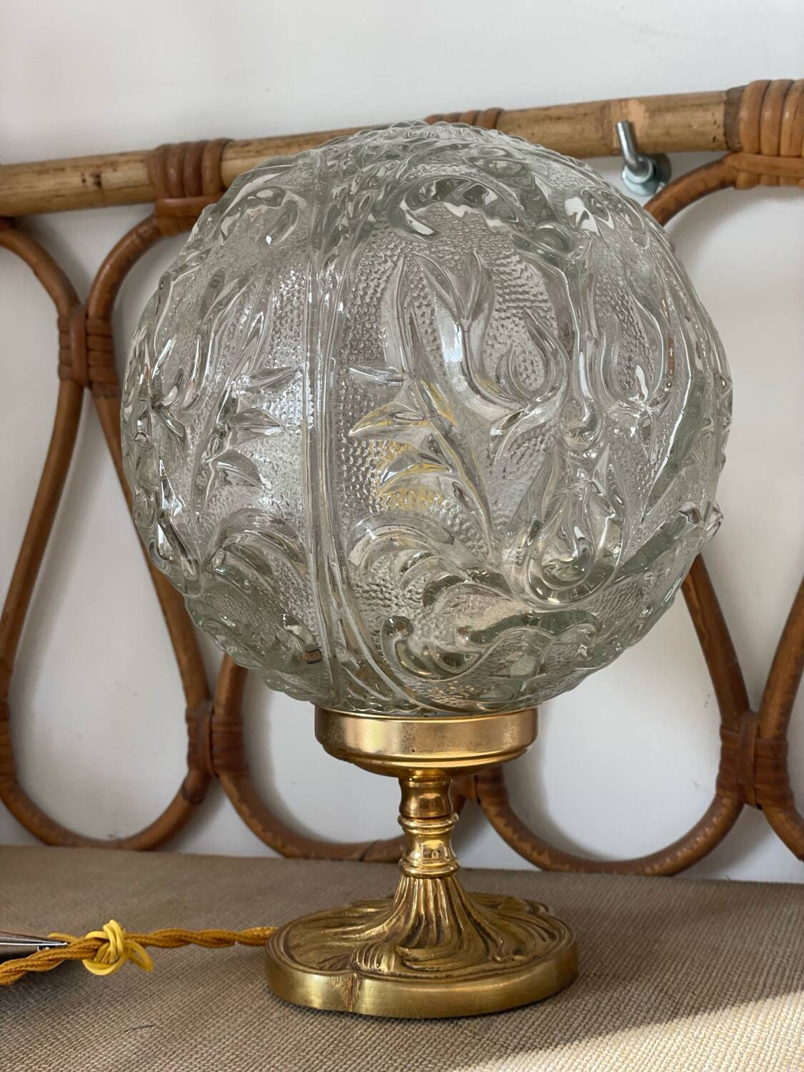 Textured round globe table lamp with a gold brass base